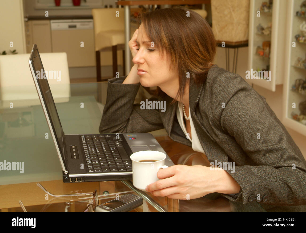 Young, desperated business woman using laptop Stock Photo