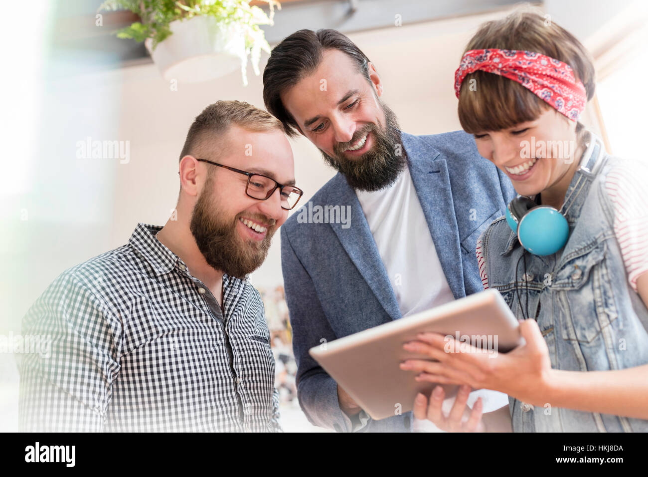 Smiling design professionals using digital tablet Stock Photo