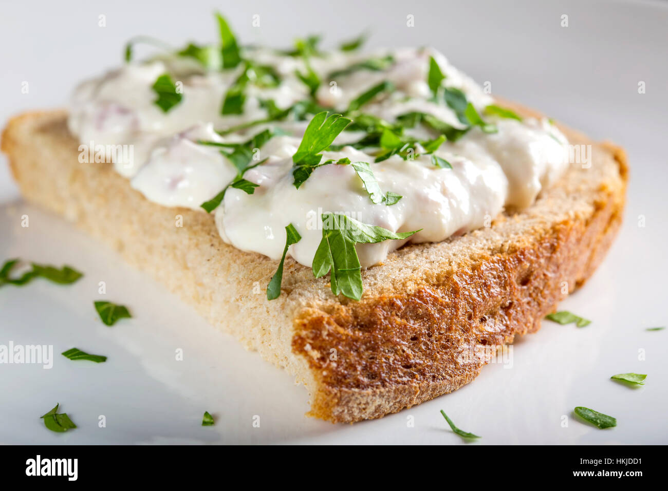 Appetizer made from horseradish, sour cream and mayonnaise on a slice of bread Stock Photo