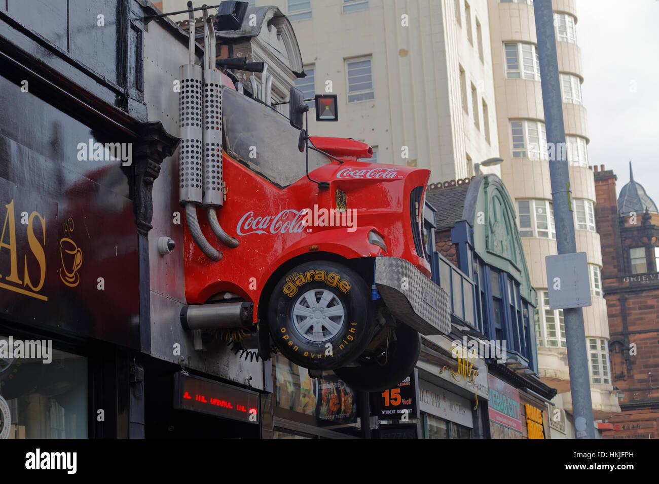 garage nightclub on sauchiehall street has replica of the coca cola Christmas truck above its doorway mounted on the wall Stock Photo