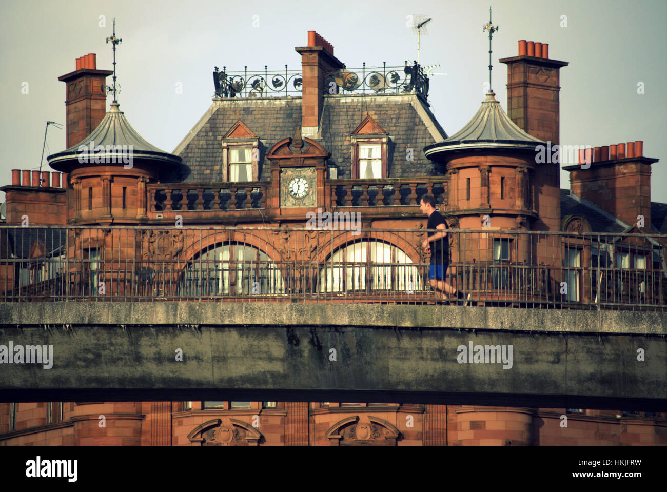 people on the pedestrian bridge at St. Mansions at charing