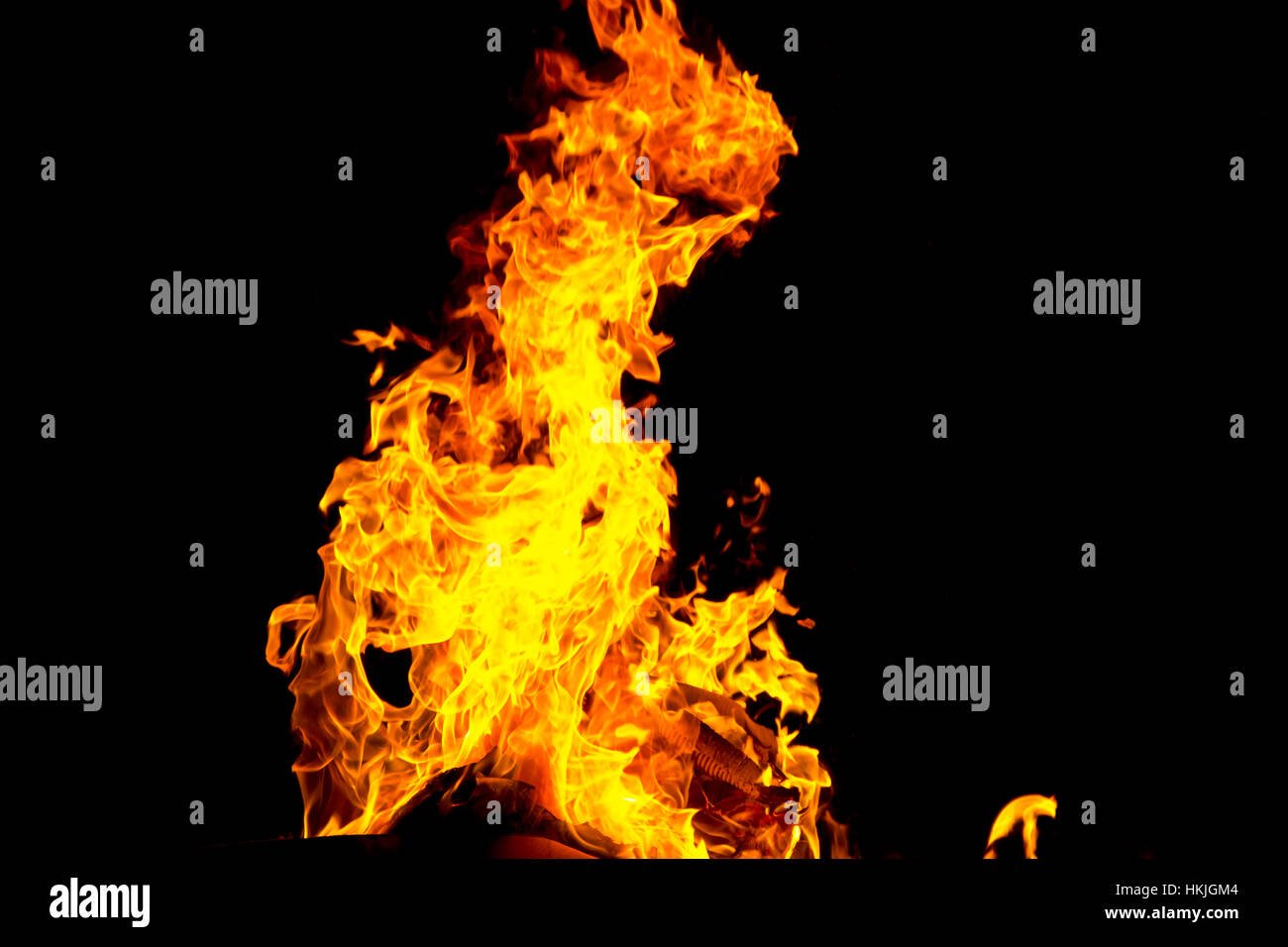 Photo of red fire flame on black background Stock Photo - Alamy