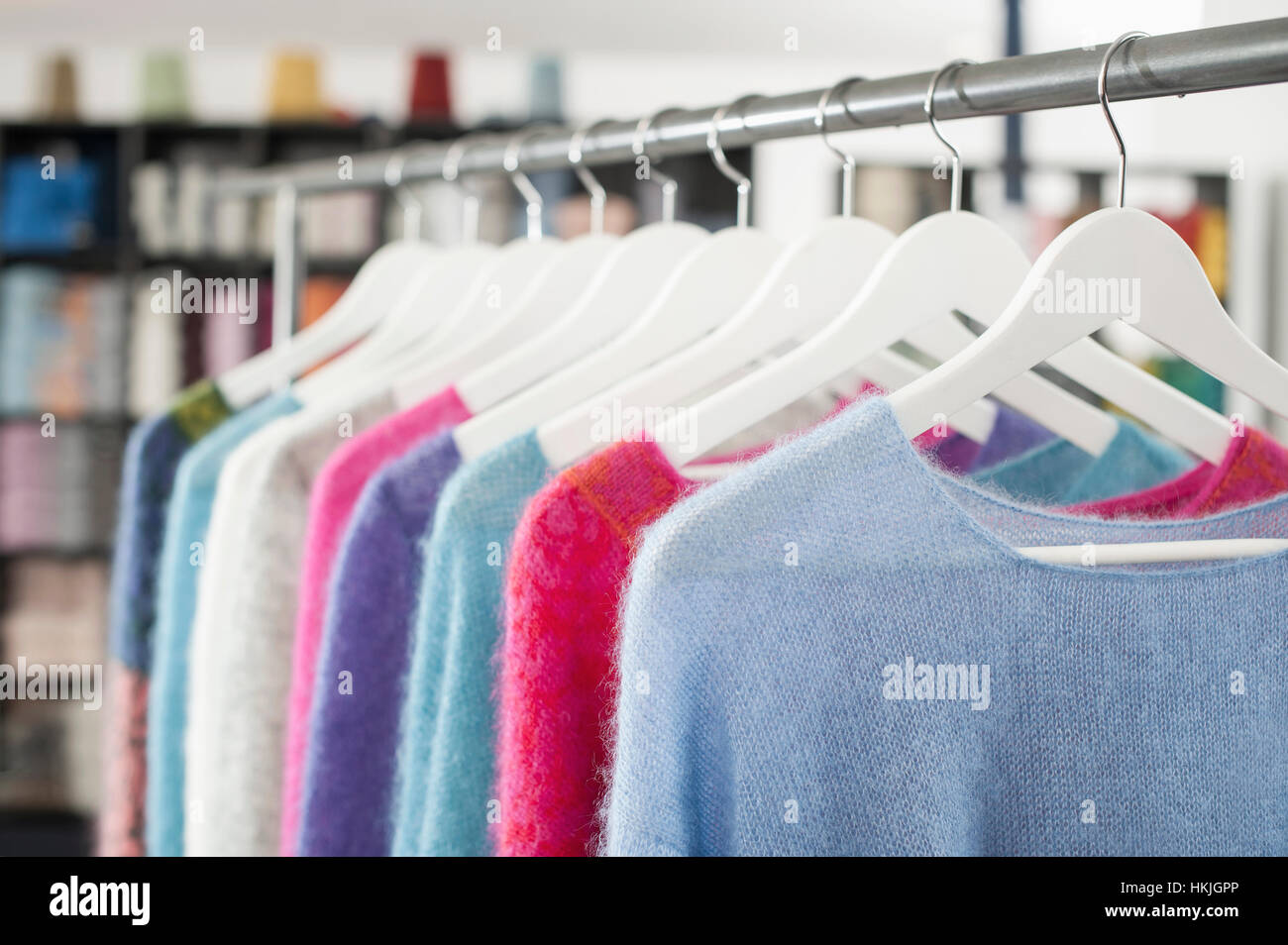 Handcrafted woollen clothes for sale at clothes shop, Bavaria, Germany Stock Photo