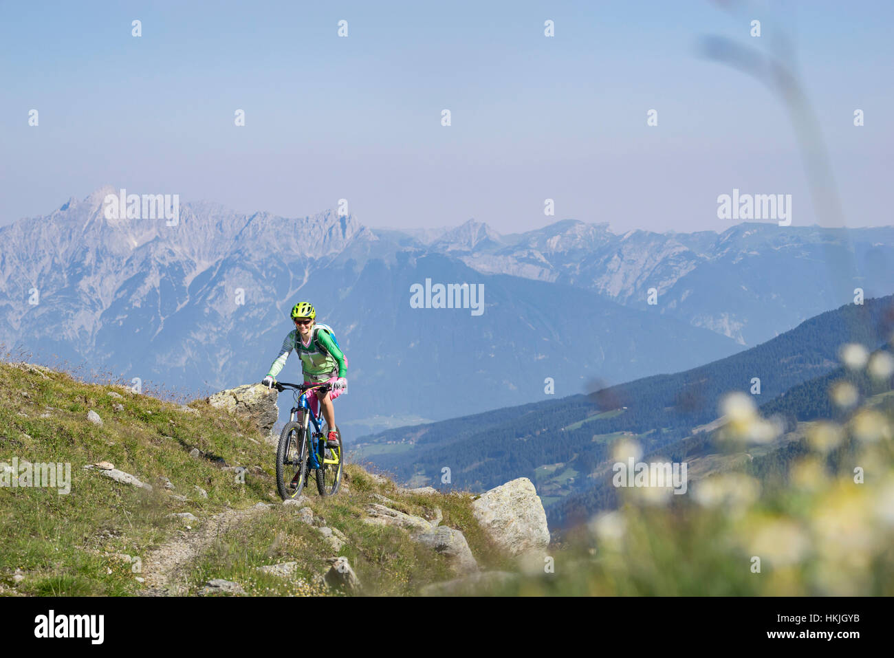 Mountain biker riding on uphill, Zillertal, Tyrol, Austria Stock Photo