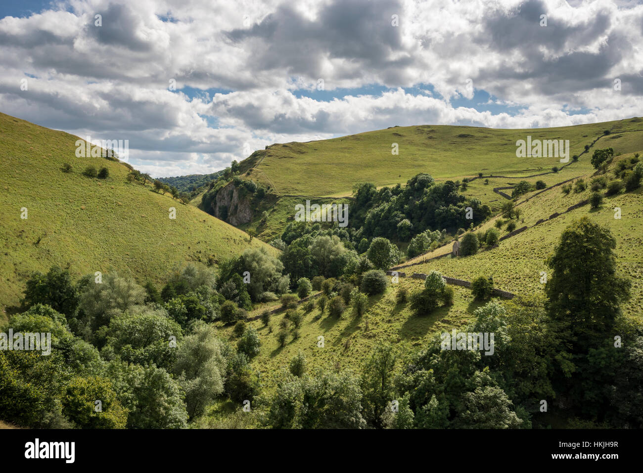 Beautiful scenery near Milldale in the Peak District national park. The steep slopes of Dovedale on a summer day. Stock Photo