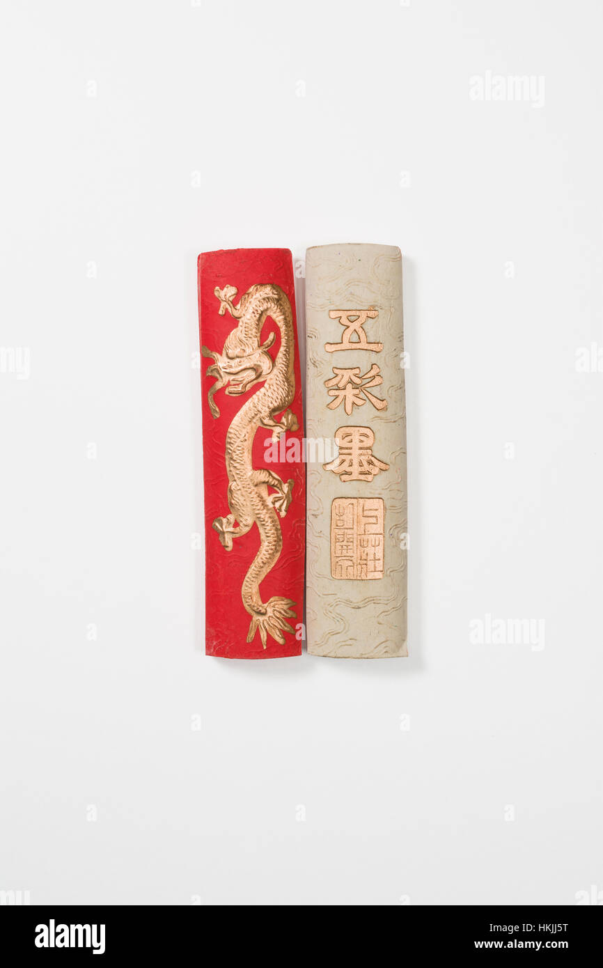 Red and White Chinese Calligraphy Ink Sticks Horizontal Photograph Isolated on White Background (with clipping path) Stock Photo