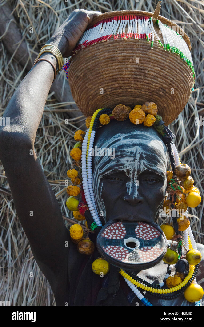 Mursi tribe people with lip plate, Mursi Village, South Omo, Ethiopia Stock Photo