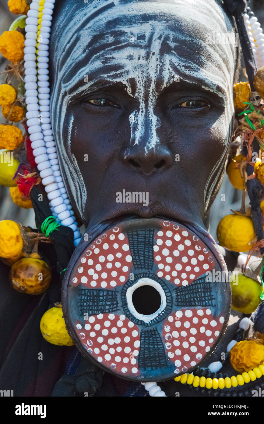 Mursi tribe people with lip plate, Mursi Village, South Omo, Ethiopia Stock Photo