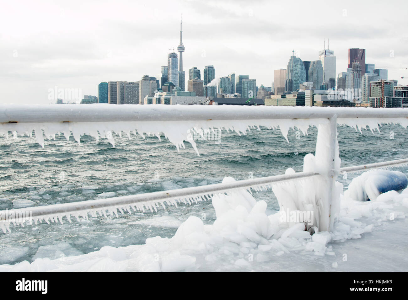 Skyline of Toronto during winter season with ice in Lake Ontario Stock