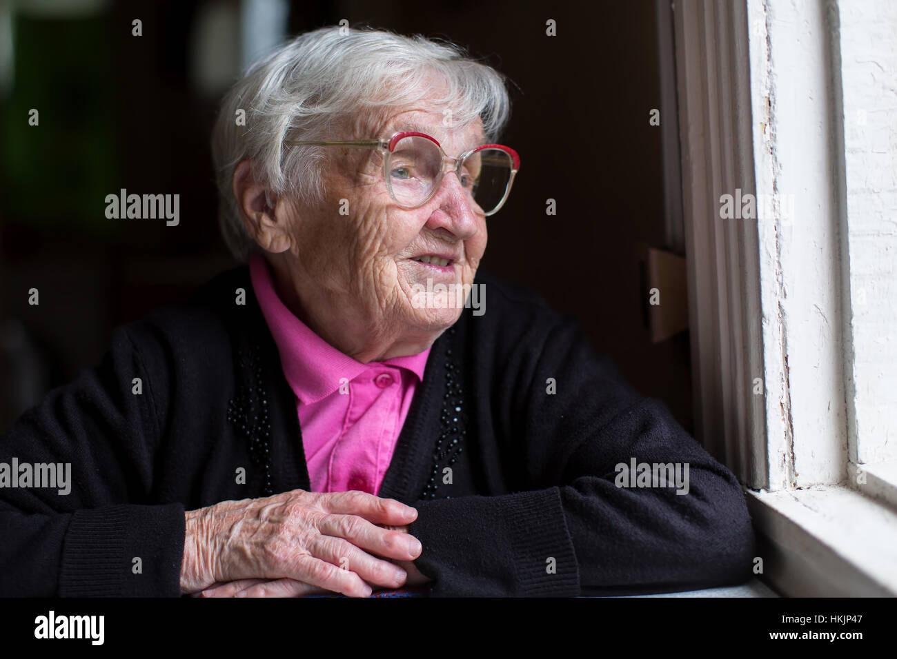 Sad elderly lady sitting in hi-res stock photography and images - Alamy