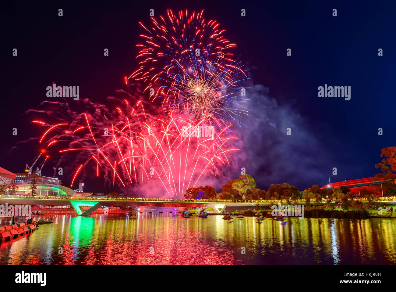 Australia Day fireworks in Elder Park, Adelaide city viewed accross Torrens foot bridge Stock