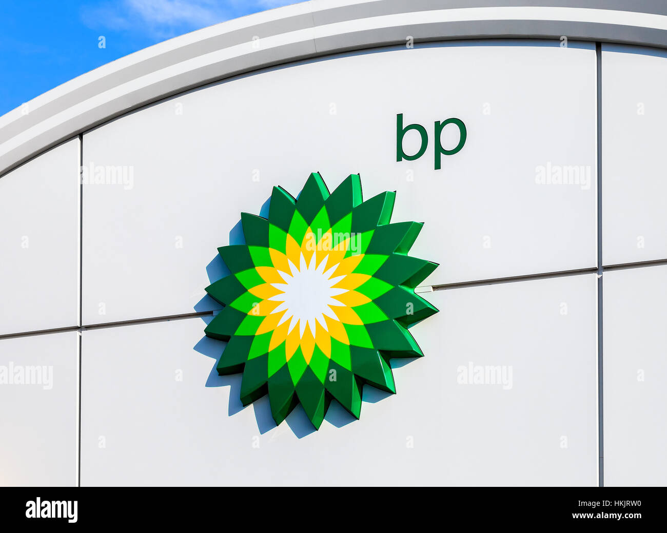 BP - British Petroleum petrol station logo over blue sky. British Petroleum is a British multinational oil and gas com Stock Photo