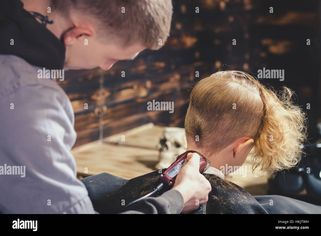 Little Boy Getting Haircut By Barber Stock Photo