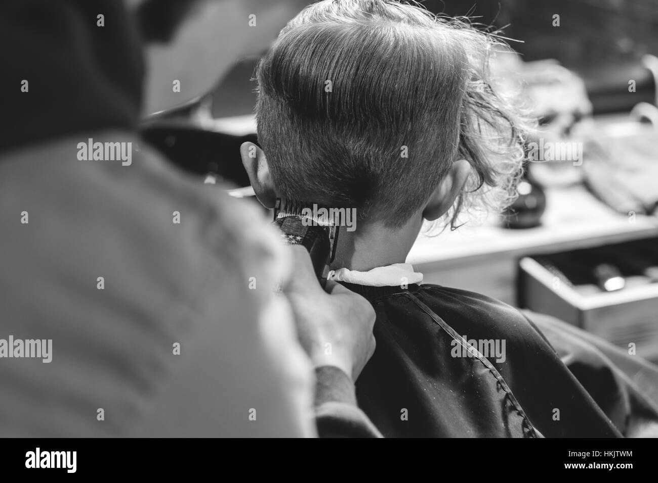 Little Boy Getting Haircut By Barber Stock Photo - Alamy