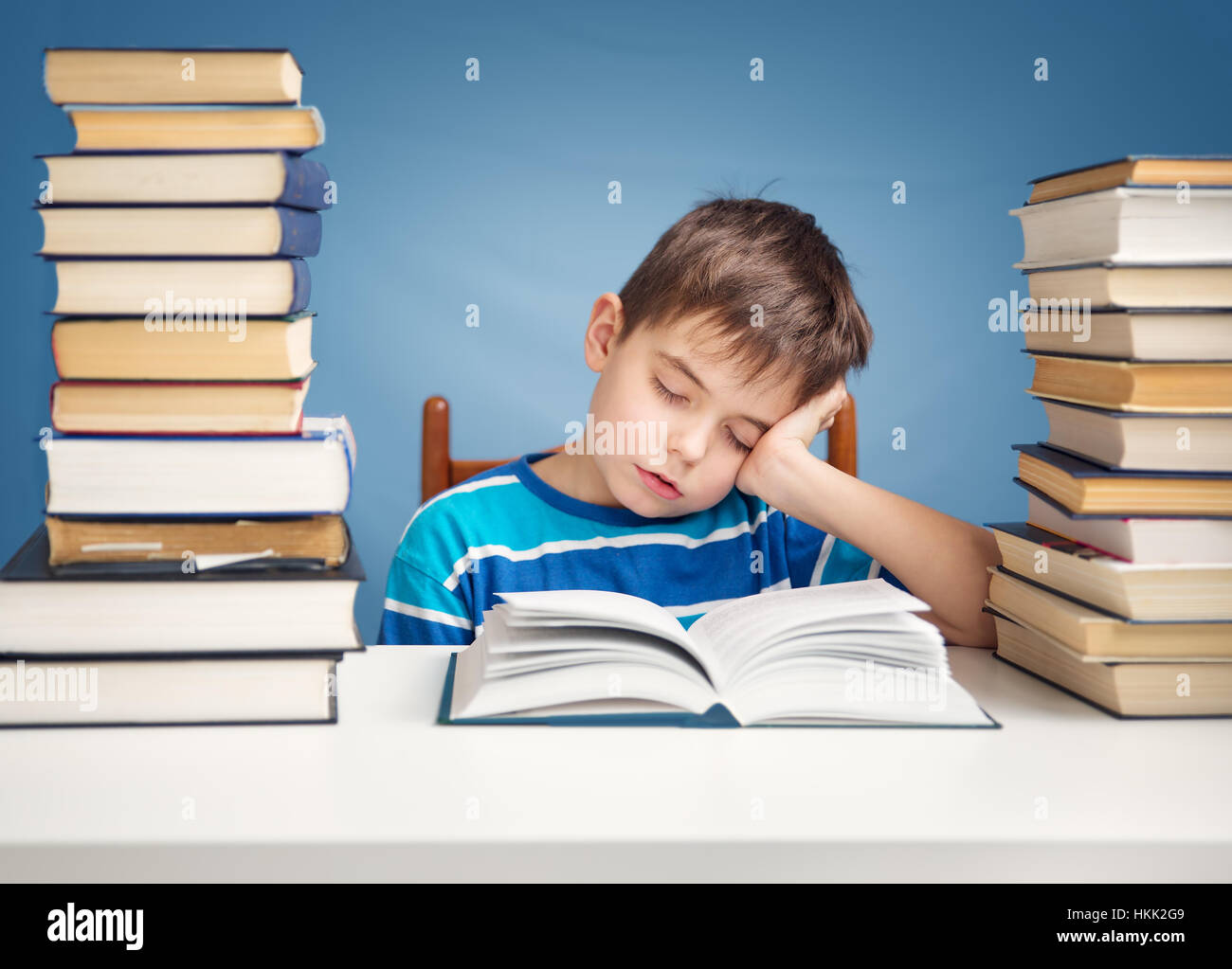 seven years old child reading a book Stock Photo Alamy