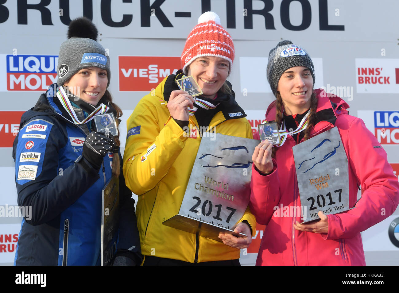 Innsbruck, Austria. 28th Jan, 2017. US American luger Erin Hamlin (2nd place, L-R), German luger Tatjana Hüfner (1st place), and Canadian luger Kimberley McRae (3rd place) hold up their medals for women's singles during the victory ceremony at the Luge World Cup in Innsbruck, Austria, 28 January 2017. Photo: Tobias Hase/dpa/Alamy Live News Stock Photo