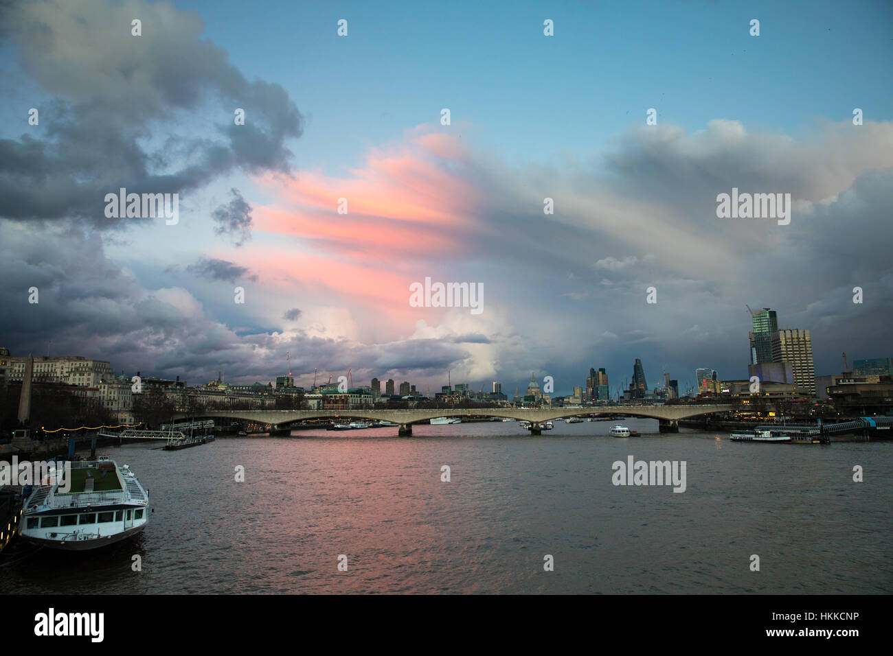 London, UK. 28th January, 2017. Beautiful evening view over Waterloo Bridge, seen from Charing Cross, with pink clouds at sunset. Credit: Carol Moir/Alamy Live News. Stock Photo
