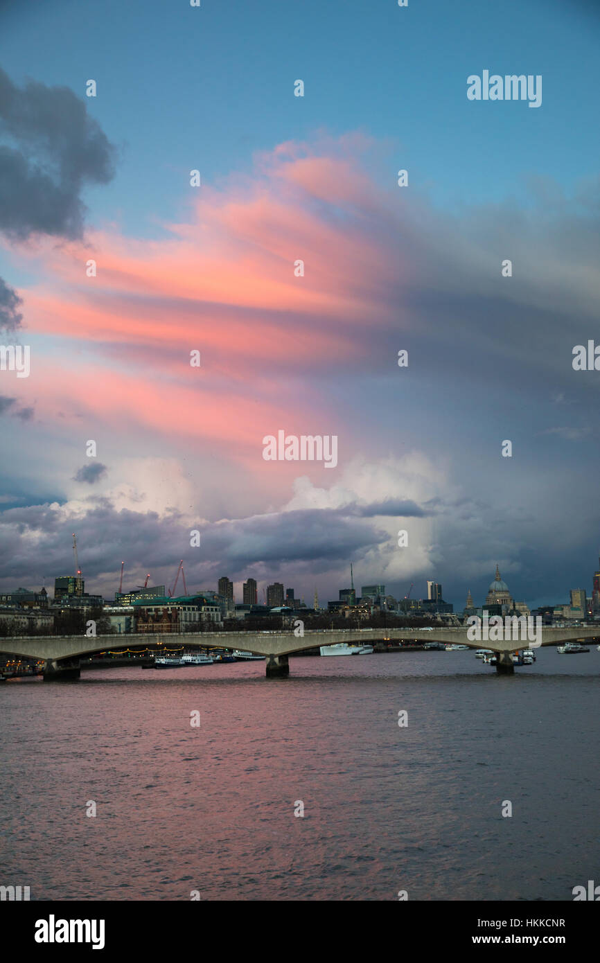 London, UK. 28th January, 2017. Beautiful evening view over Waterloo Bridge, seen from Charing Cross, with pink clouds at sunset. Credit: Carol Moir/Alamy Live News. Stock Photo