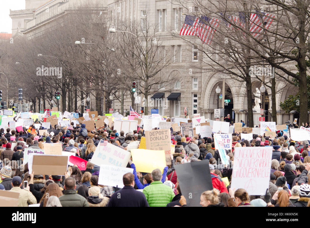 Washington, USA. 29th January, 2017. Protesters march down Pennsylvania Avenue towards the Trump International Hotel, in opposition of President Donald Trump's proposed immigration policies and ban on Muslim entry, in Washington, D.C. Credit: Angela Drake/Alamy Live News Stock Photo