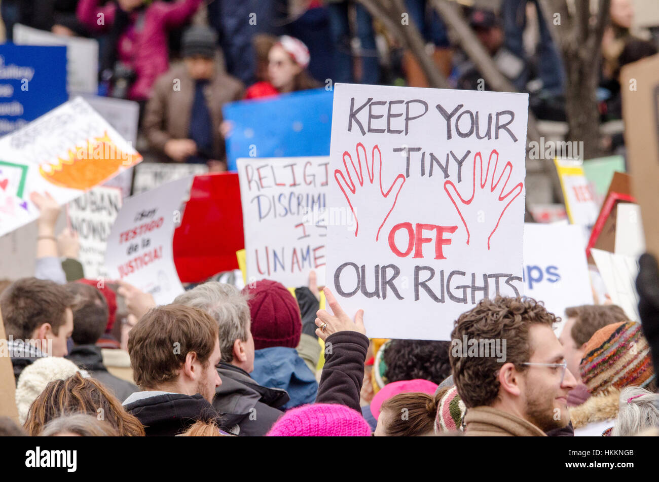 Washington, USA. 29th Jan, 2017. Protester holds sign that reads, 'Keep Your Tiny 'hands' Off Our Rights' during a protest opposing Donald Trump's immigration policies and refugee ban, in Washington D.C. Credit: Angela Drake/Alamy Live News Stock Photo