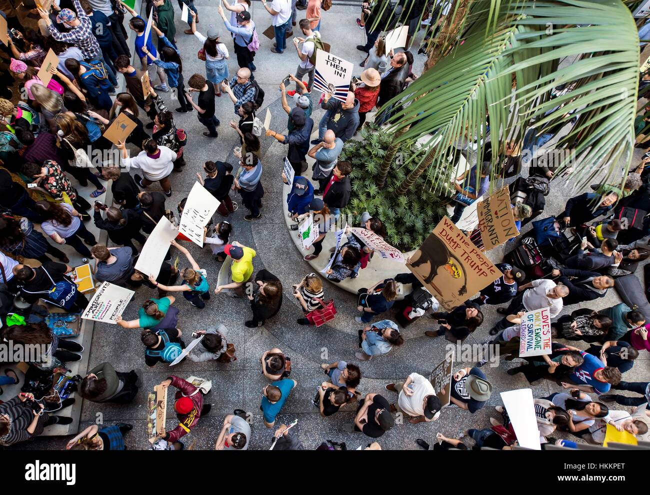 Los Angeles, USA. 29th Jan, 2017. For the second day in a row, people gather at the Tom Bradley International Terminal at Los Angeles International Airport to protest President Trump's executive order on immigration. Signed two days ago, the order barred the entry of all refugees to the United States for the next 120 days and for 90 days for citizens of seven predominantly Muslim countries. Credit: Brian Cahn/ZUMA Wire/Alamy Live News Stock Photo