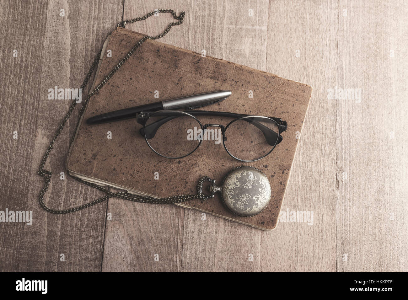 Vintage pocket  watch with pen and paper,from above Stock Photo