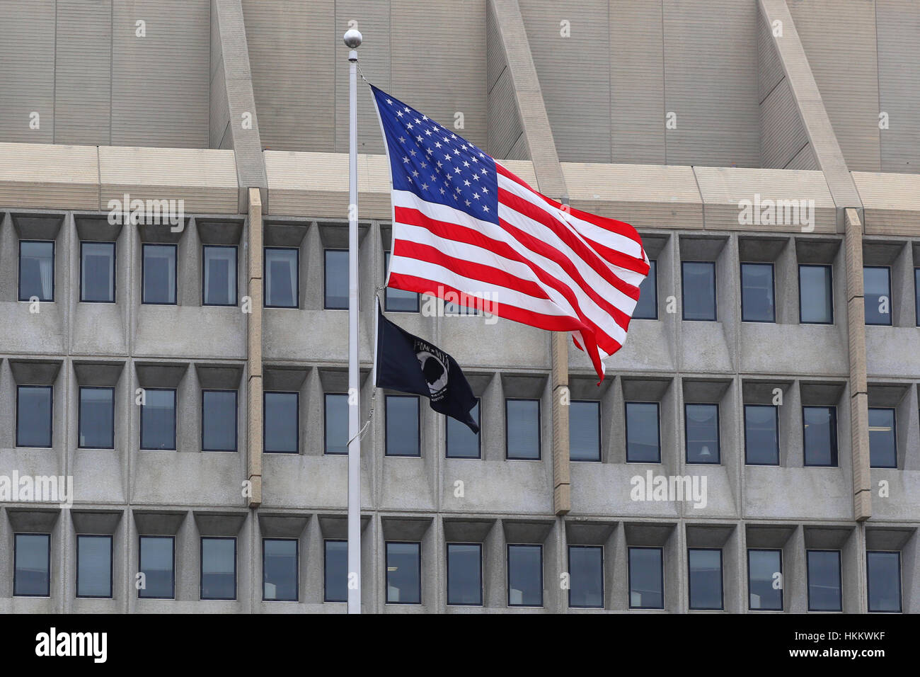 An American Flag, and POW-MIA flag in front of the US Department of Health and Human Services building. Stock Photo