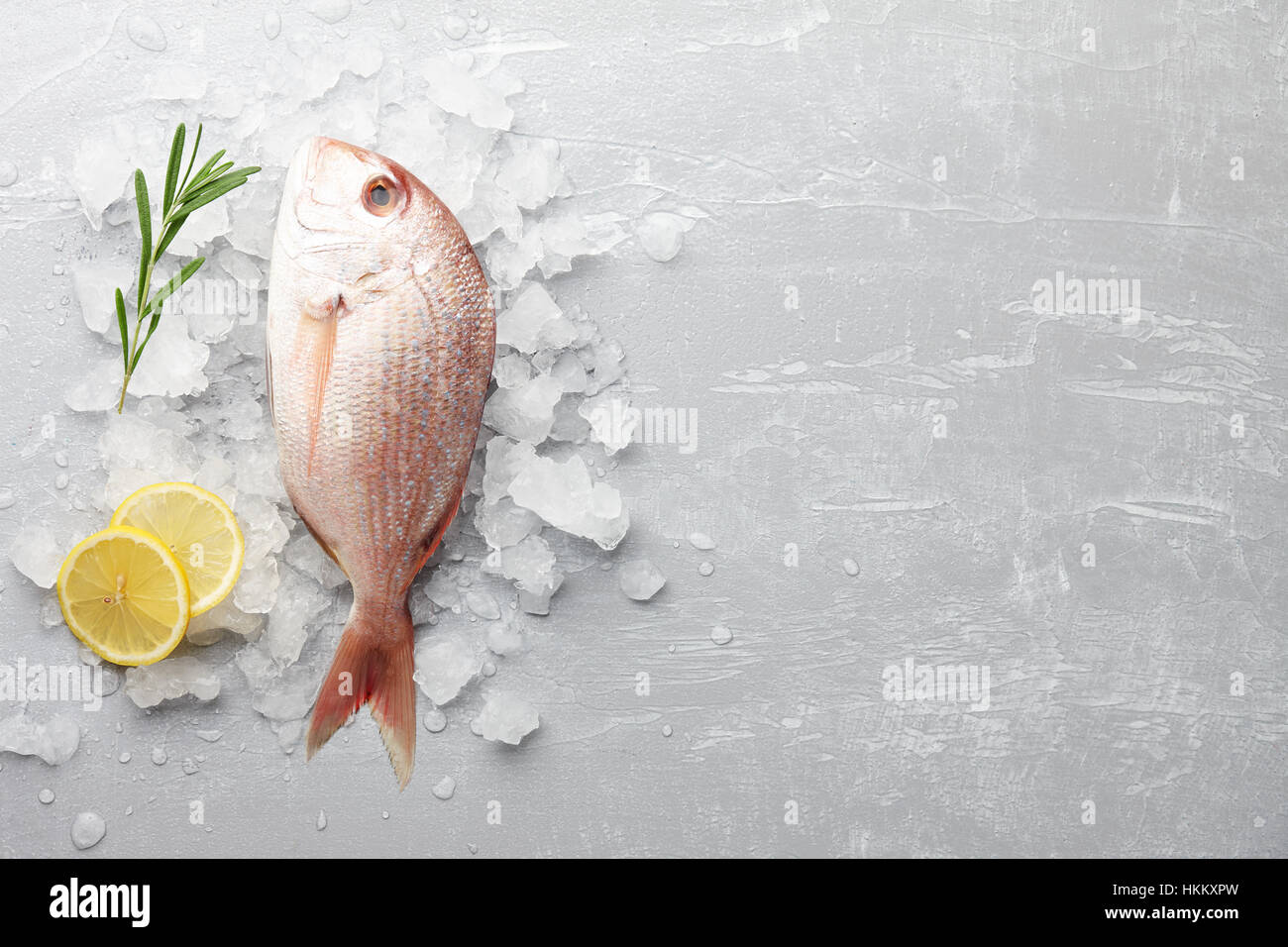 Fresh red Japanese seabream cooking on gray stone background, top view Stock Photo
