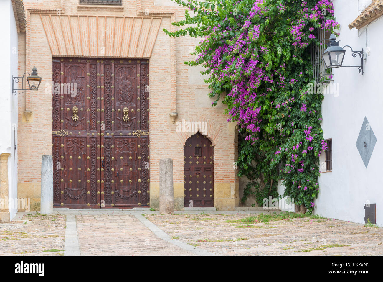 CORDOBA, SPAIN - MAY 26, 2015:  House facade and carved gate from Plaza del Jeronimo Paez square. Stock Photo