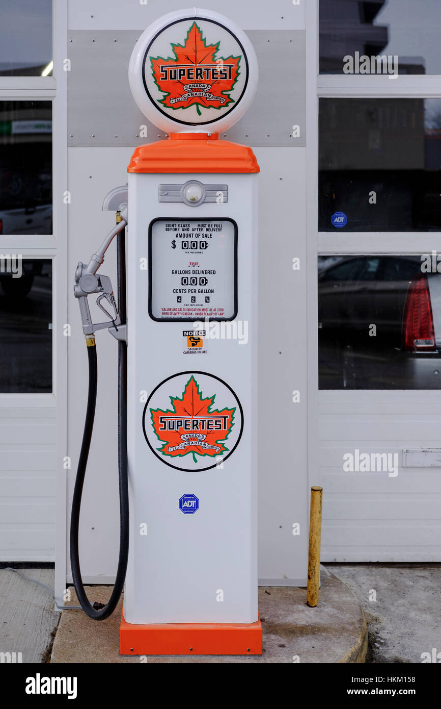 Vintage white Supertest fuel pump in front of a service station in London, Ontario, Canada. Stock Photo