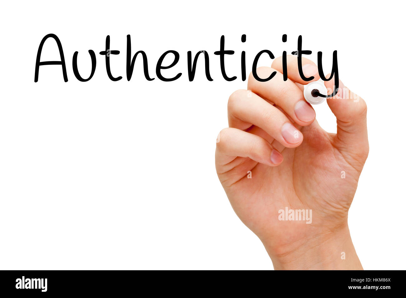 Hand writing Authenticity with black marker on transparent glass board. Stock Photo