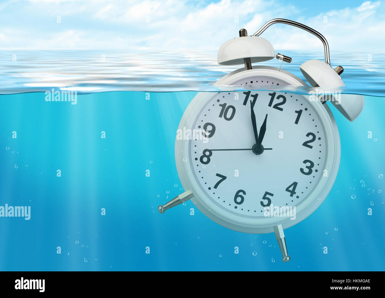 Clock in water, time limited concept Stock Photo