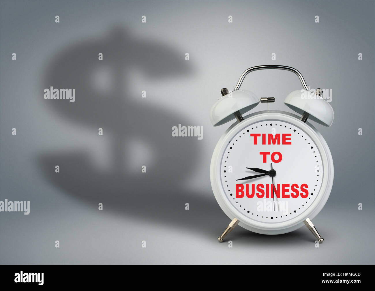 Alarm clock with dollar shadow, time to business startup concept Stock Photo