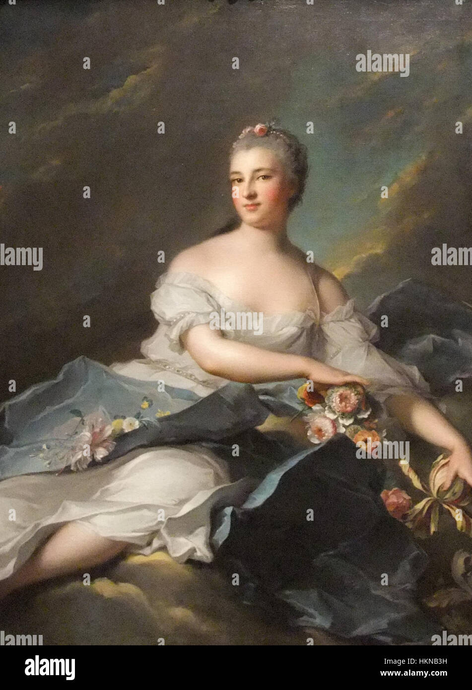 This portrait of Baronne Rigoley d'Ogny as Aurora, painted by Jean-Marc Nattier, features the aristocratic figure in the guise of the Roman goddess of dawn, Aurora. The work highlights Nattier's skill in portraying nobility in mythological themes. Stock Photo