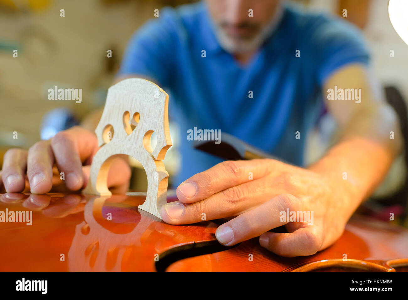 installing an string instrument bridge Stock Photo Alamy