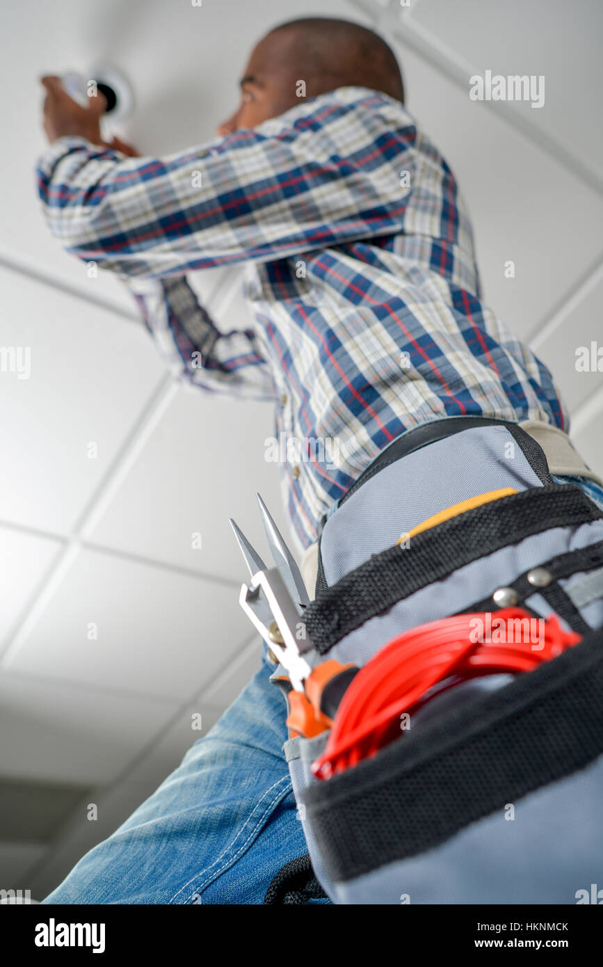Replacing a ceiling bulb Stock Photo - Alamy