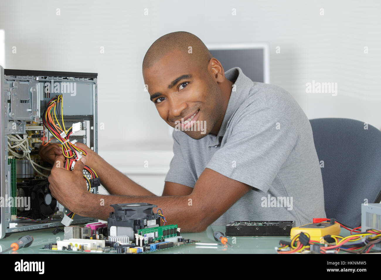 Computer Rebort Man Computer repairman at work Stock Photo - Alamy