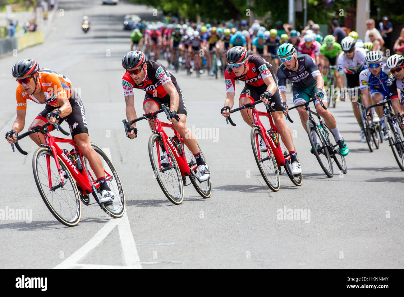 Richie Porte (AUS) from the BMC Racing Team leads a group of riders during stage 6 of the 2017 Tour Down Under through the streets of Adelaide Austral Stock Photo