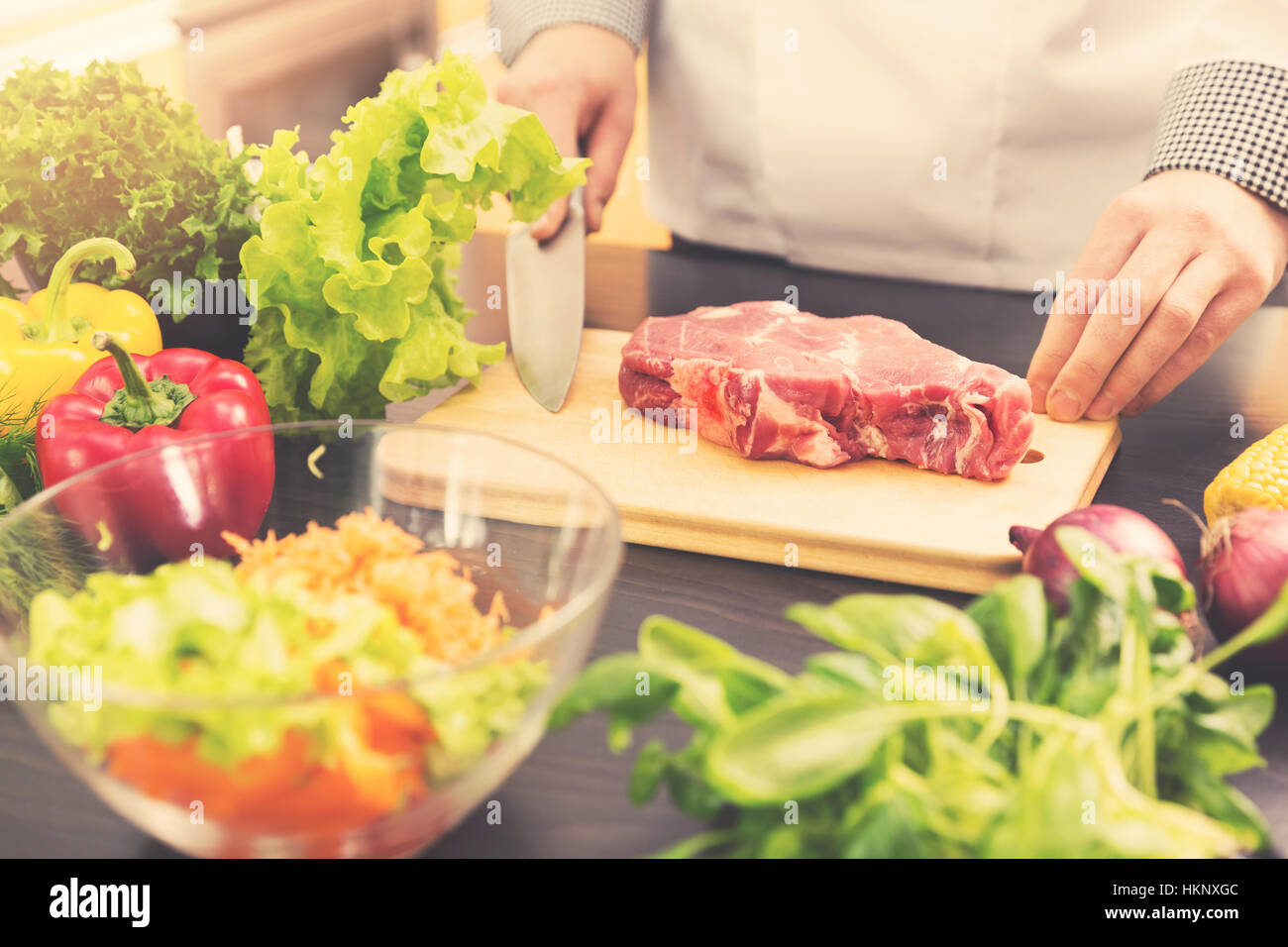 cook is ready for raw meat preparation Stock Photo