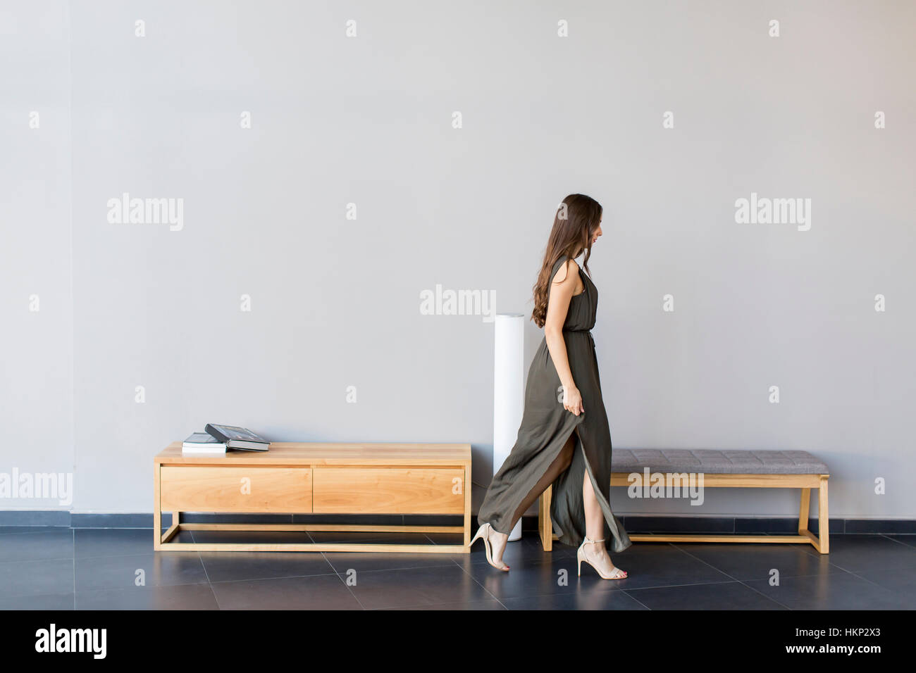 Young woman posing in the room Stock Photo - Alamy