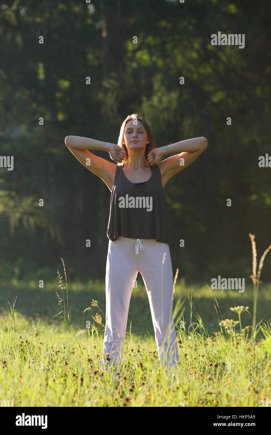 Beautiful young woman relaxing in nature Stock Photo - Alamy