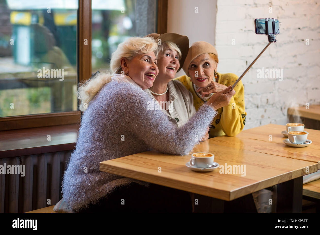 Selfie of ladies in cafe. Stock Photo