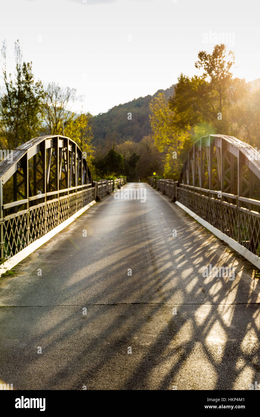 Old steel road bridge over Merse river in Italy Stock Photo