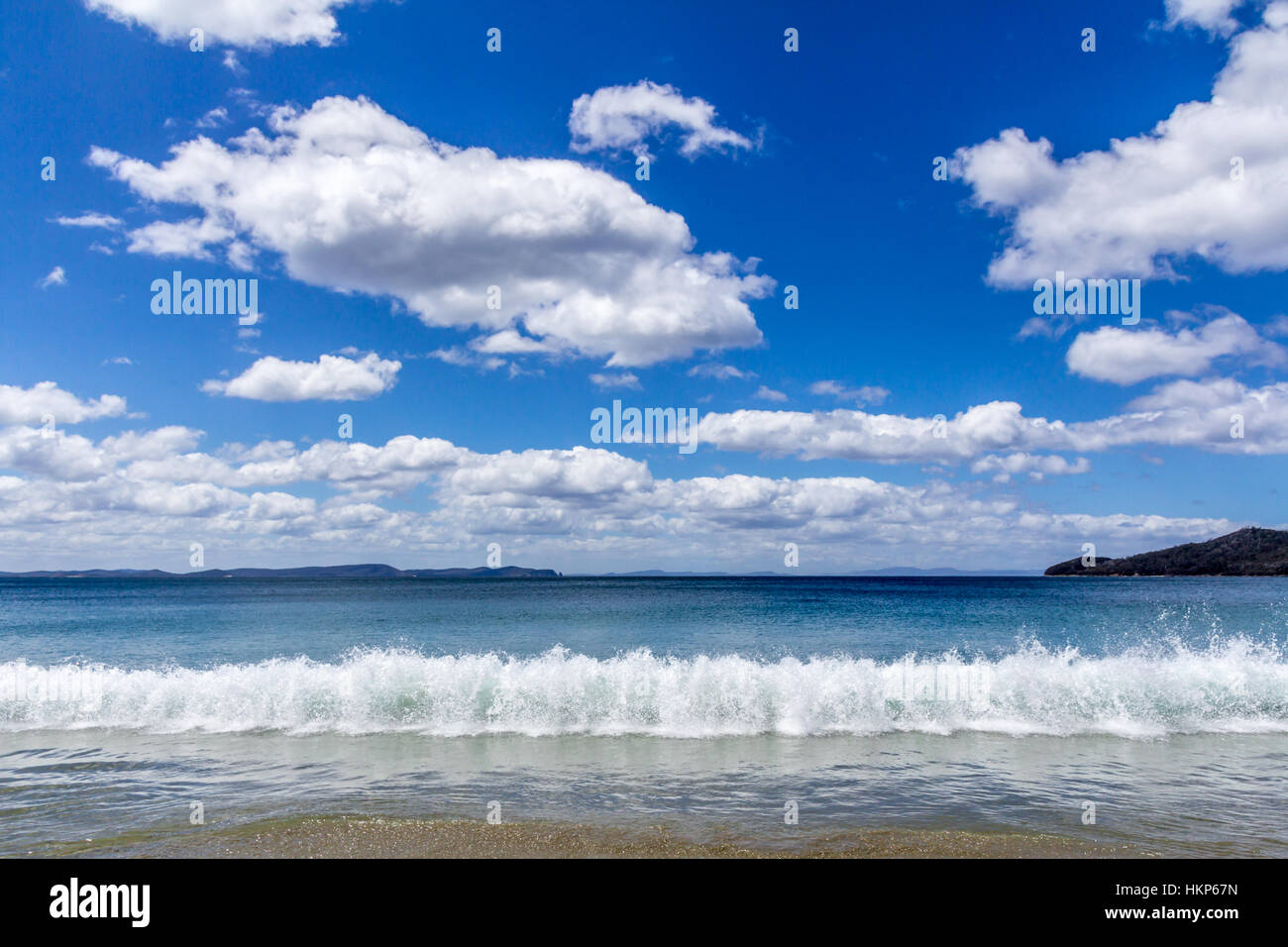 wave breaking on Adventure Bay beach, Bruny Island, Tasmania, Australia