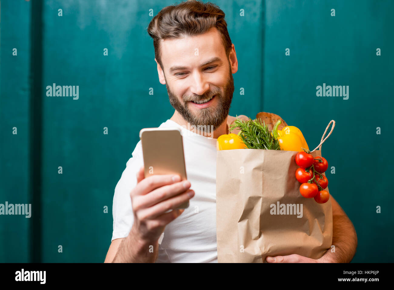 Man buying food online Stock Photo - Alamy