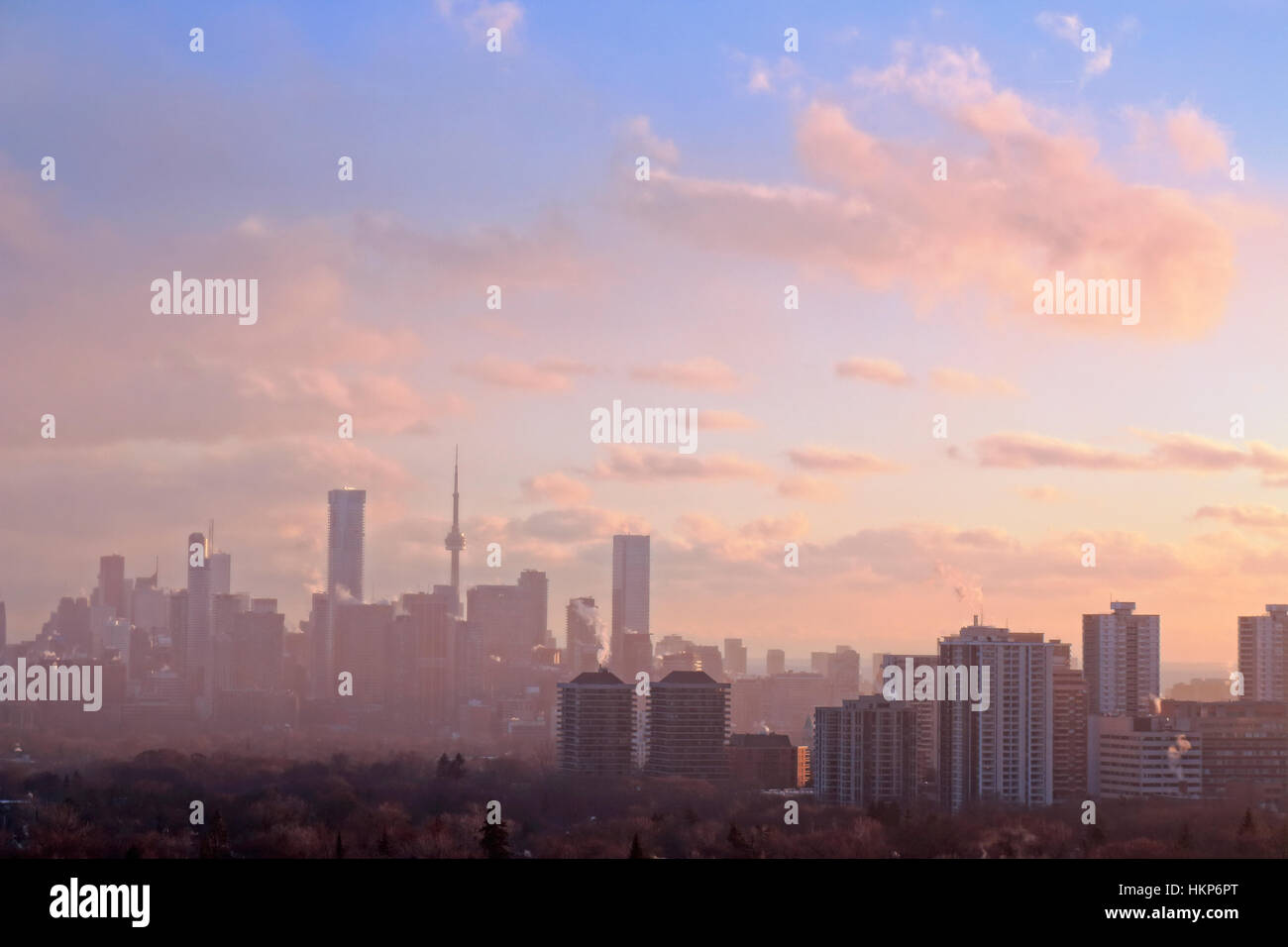Toronto downtown and midtown skline with fog and pink winter sunset clouds Stock Photo