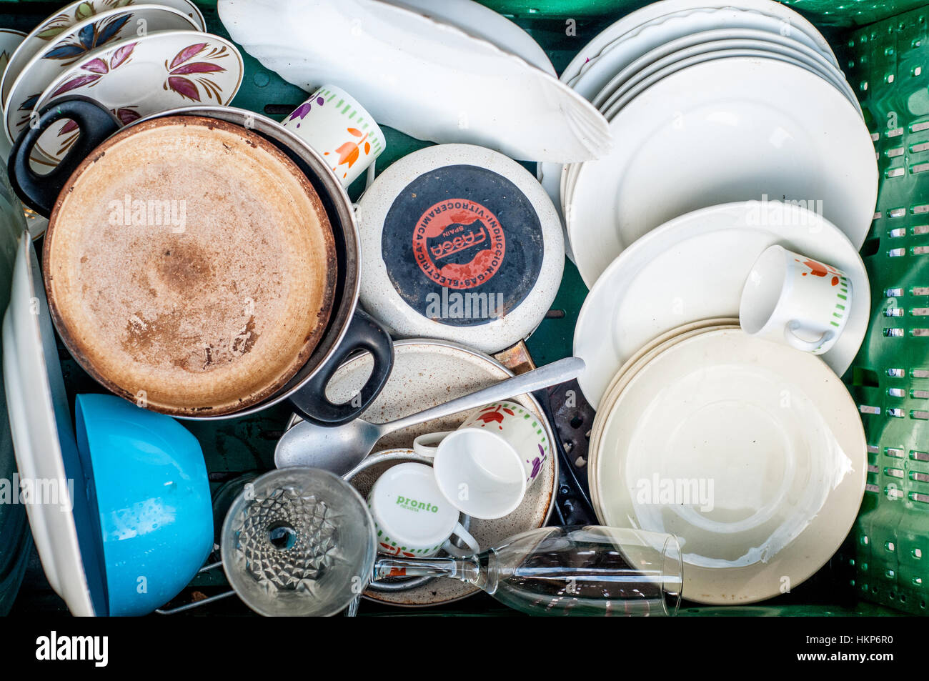Old second-hand crockery to sell on the street Stock Photo