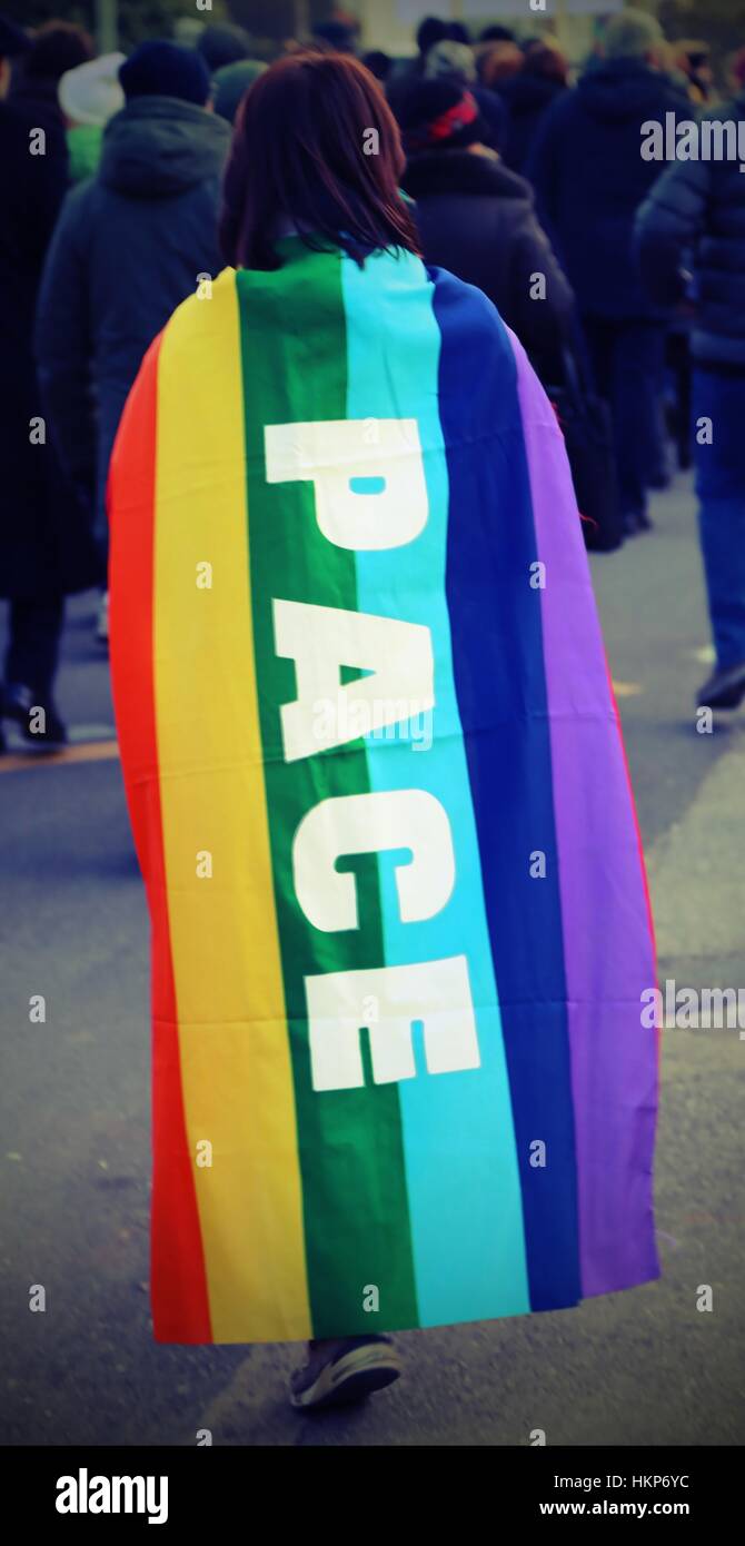 pacifist demonstration in Italy with multi-colored flag and big writing PACE which means peace in Italian Stock Photo