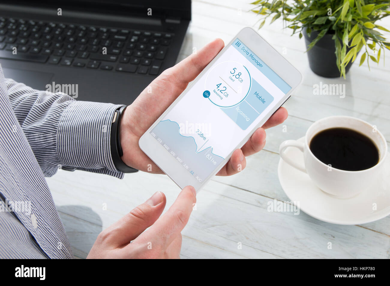 Man is checking data usage on his smartphone Stock Photo