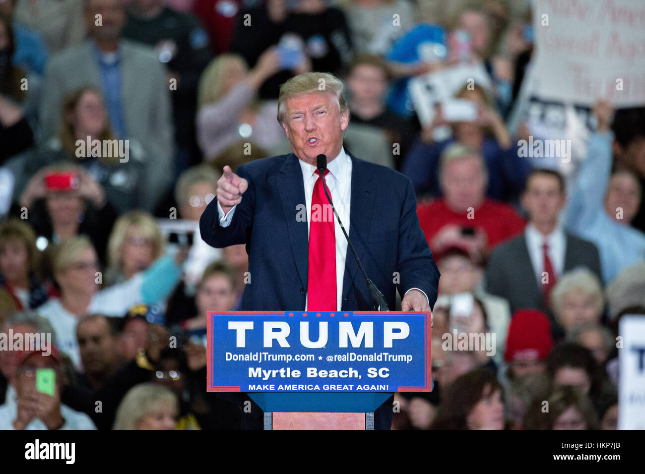 Republican presidential candidate billionaire Donald Trump points to the media riser during an attack on the reporters at a campaign rally at the Myrtle Beach Convention Center November 24, 2015 in Myrtle Beach, South Carolina. Stock Photo